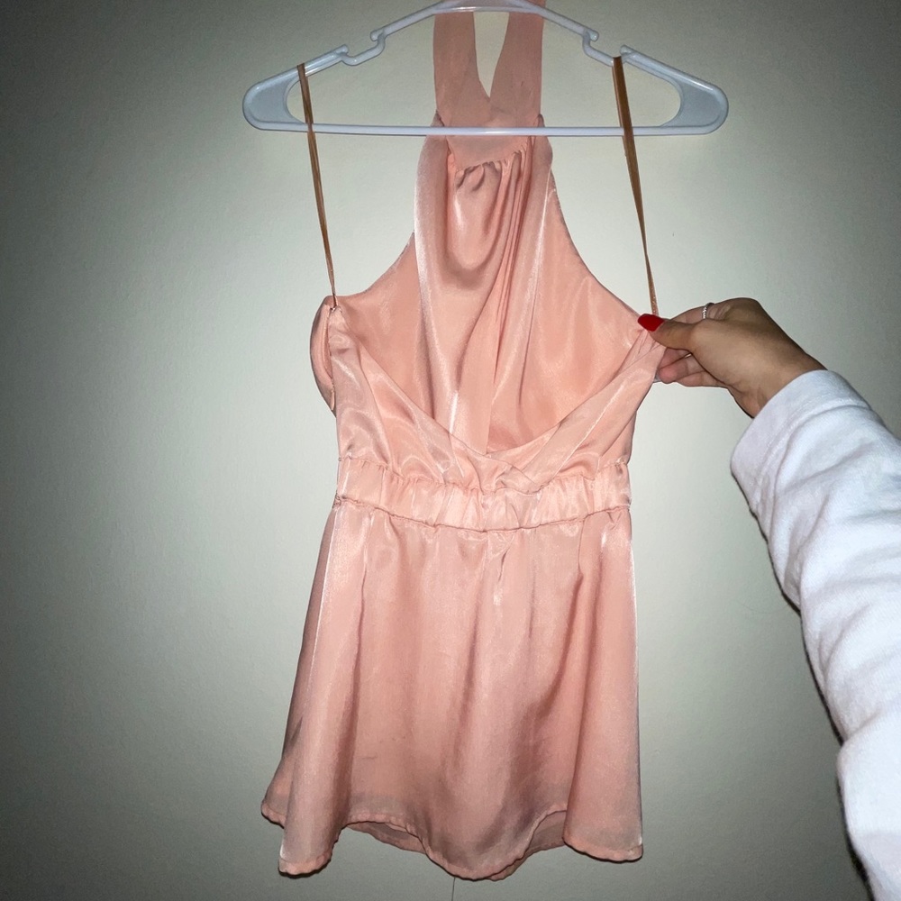 Halter open back peplum blush top